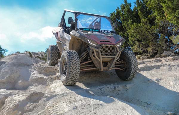 Recon Trail UTV on Rocky Terrain UTV equipped with Recon Trail tires driving over rocky off-road terrain